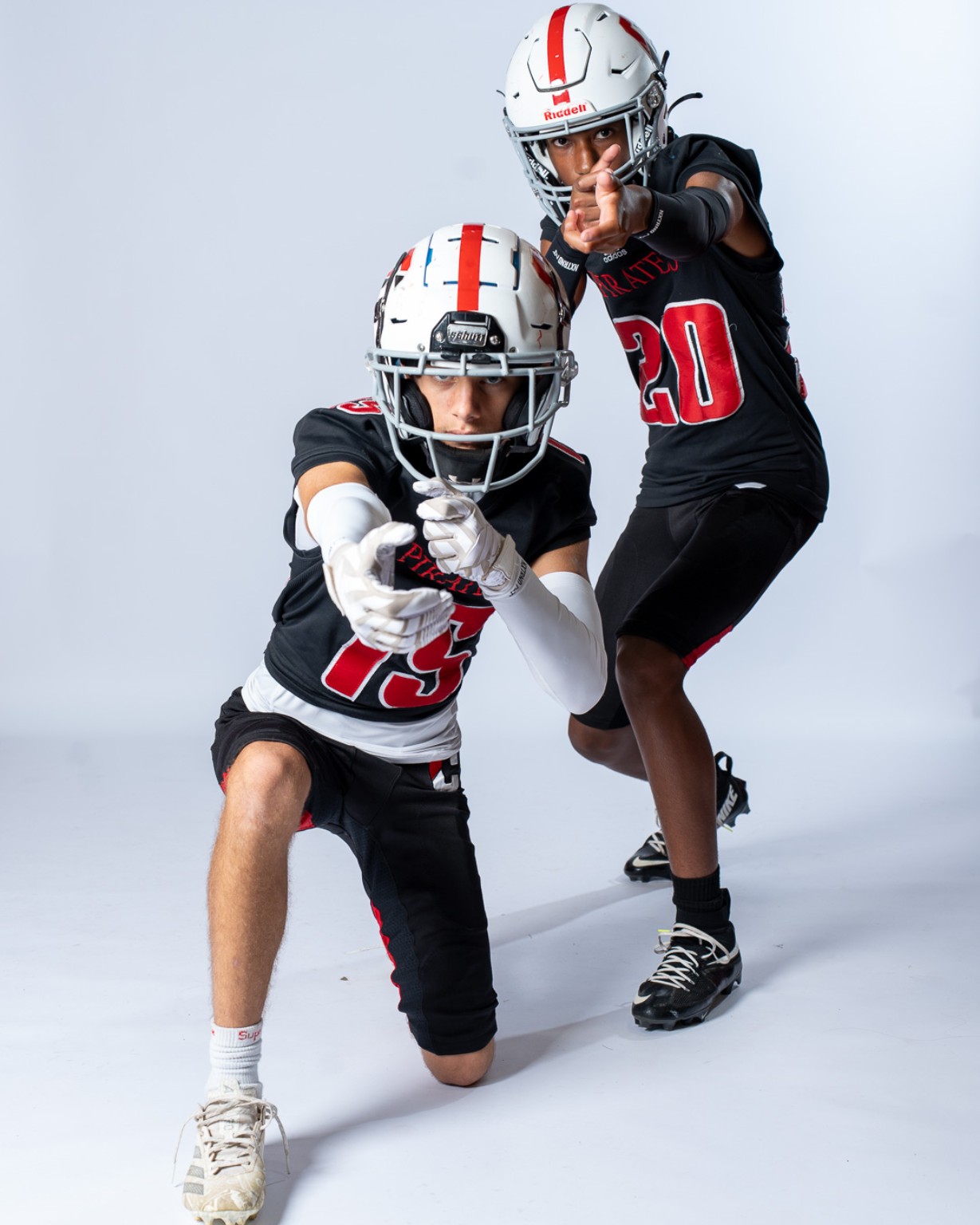 Cinnaminson Pirates football players pointing toward the camera